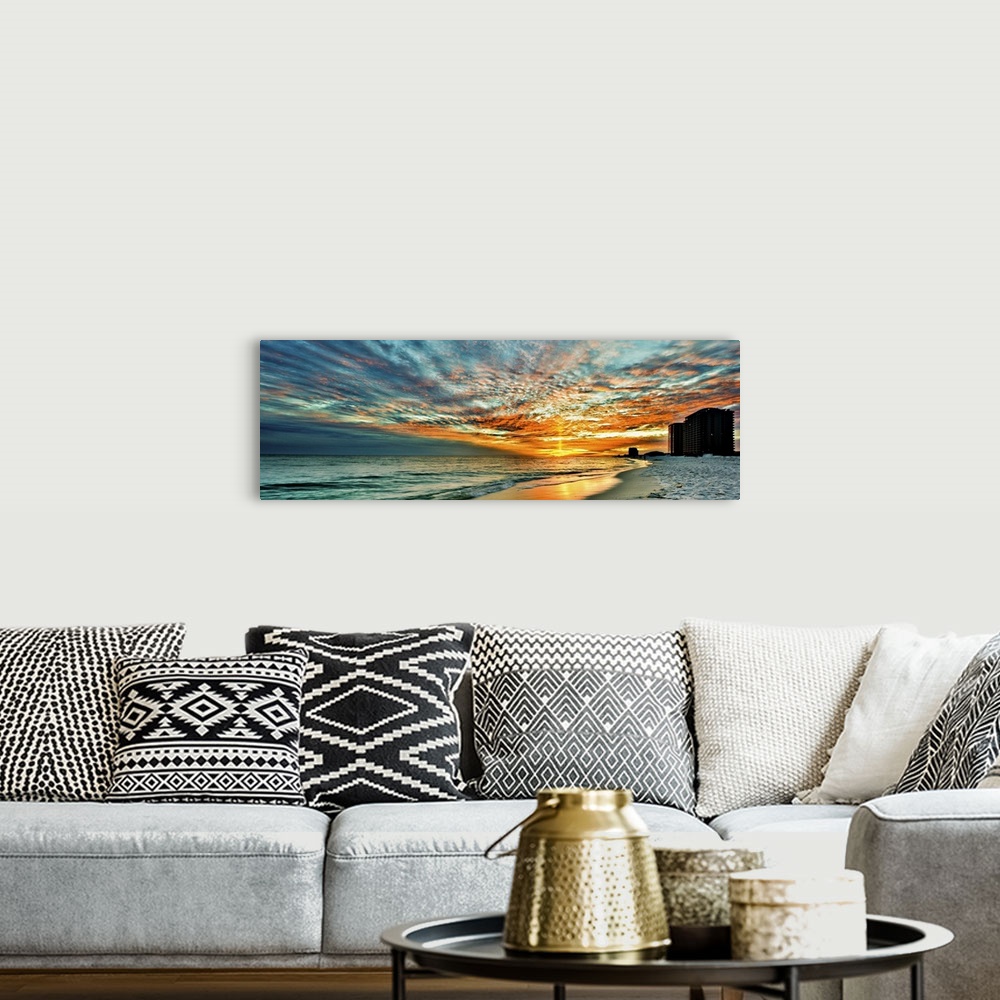 A bohemian room featuring A magnificent red skyscape in this panoramic sunset. Landscape taken on Navarre Beach, Florida.