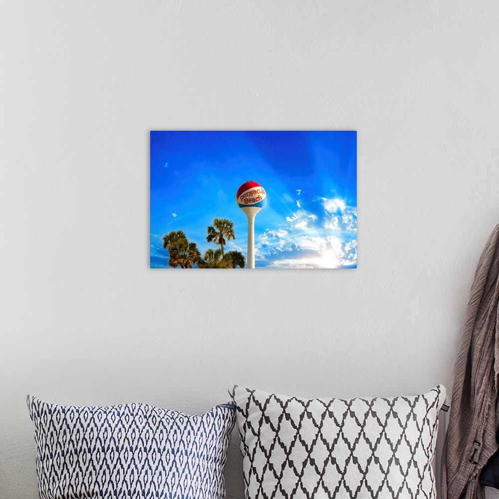 A bohemian room featuring Pensacola Beach Ball Water Tower and Palm Trees in this skyscape.
