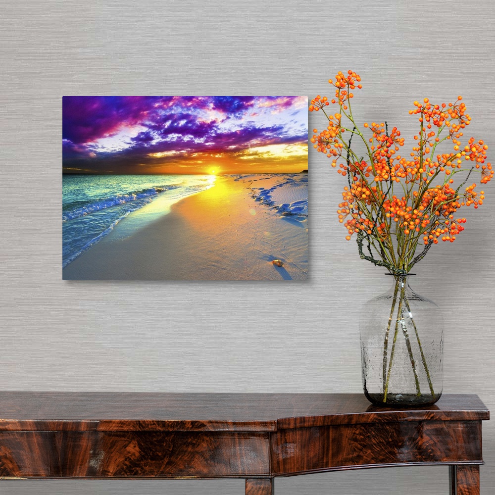 A traditional room featuring A beautiful purple and blue sunset over a sandy beach shoreline. The ocean takes up a small part ...