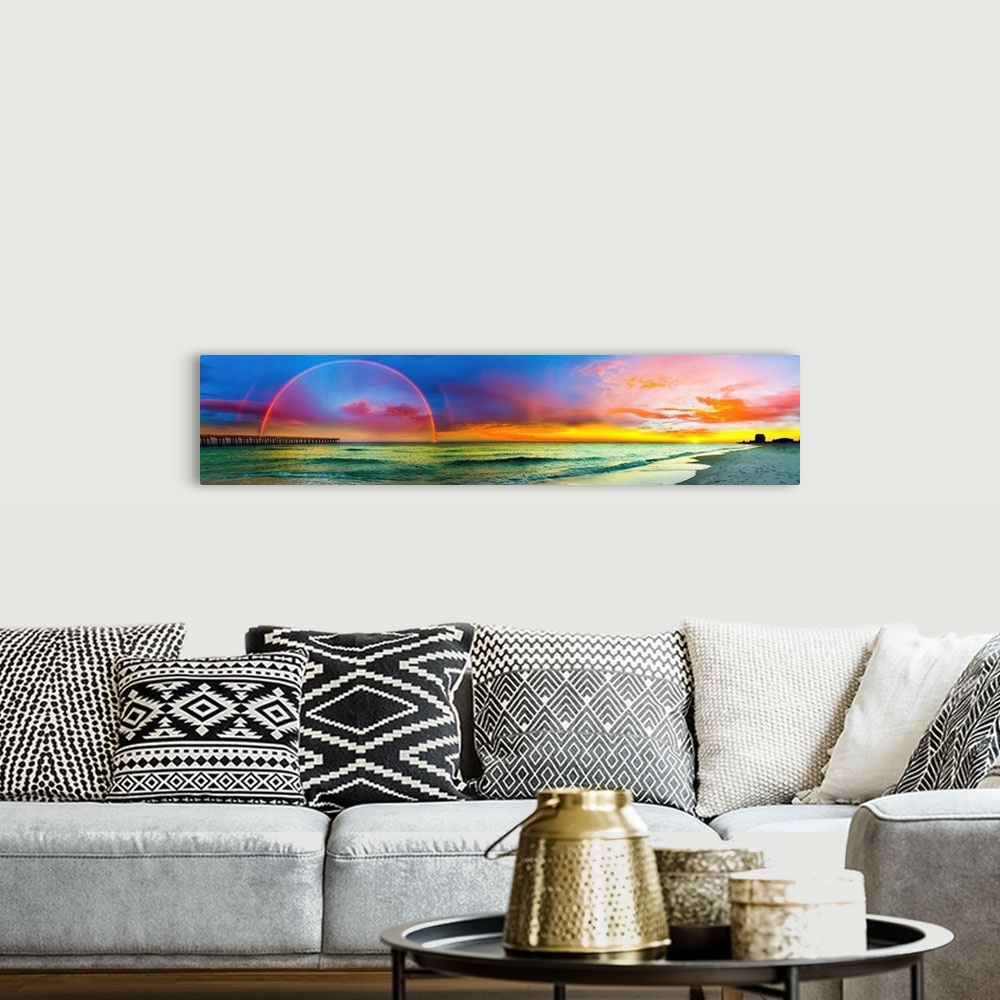 A bohemian room featuring A full rainbow across an ocean pier at sunset. The blue, purple, and red sky along with the green...