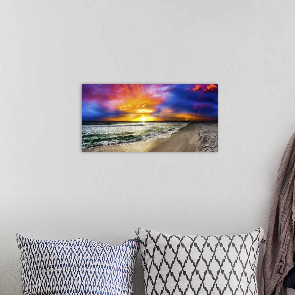 A bohemian room featuring A dark rainbow sunset with a beautiful blue, purple and red sky. This is a large beach panorama.