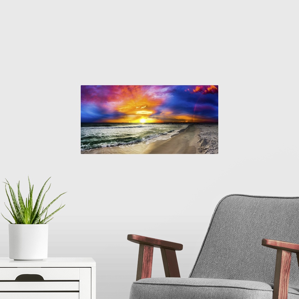 A modern room featuring A dark rainbow sunset with a beautiful blue, purple and red sky. This is a large beach panorama.