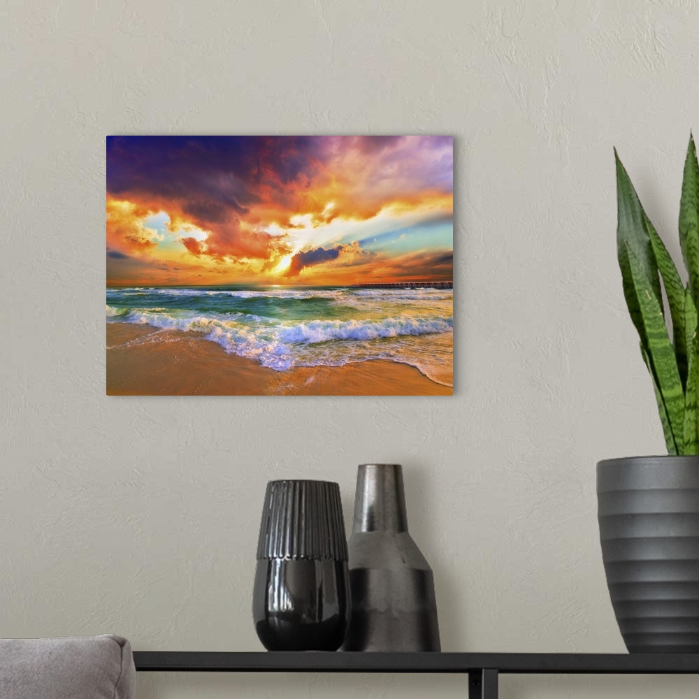 A modern room featuring A sandy beach before a bright burning red sunset. Green waves crash onto the sandy sea shore. Lan...