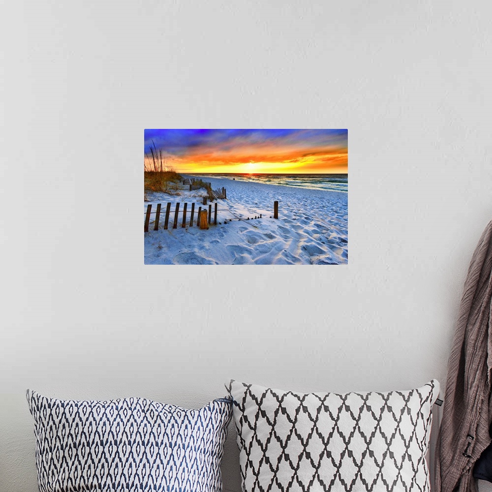 A bohemian room featuring A dark burning red sunset on the beach in this beautiful landscape. A burning sun sets in the dis...
