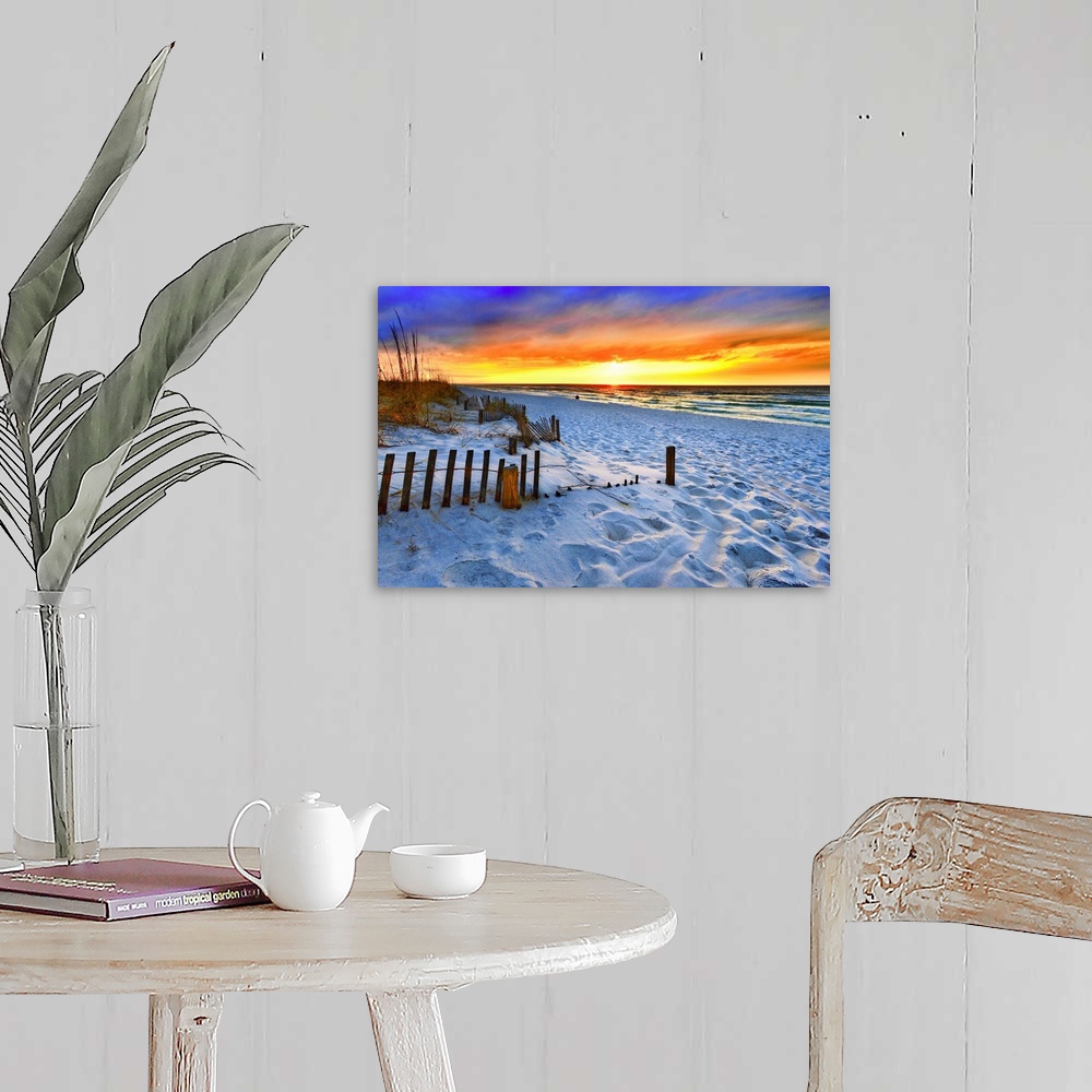 A farmhouse room featuring A dark burning red sunset on the beach in this beautiful landscape. A burning sun sets in the dis...