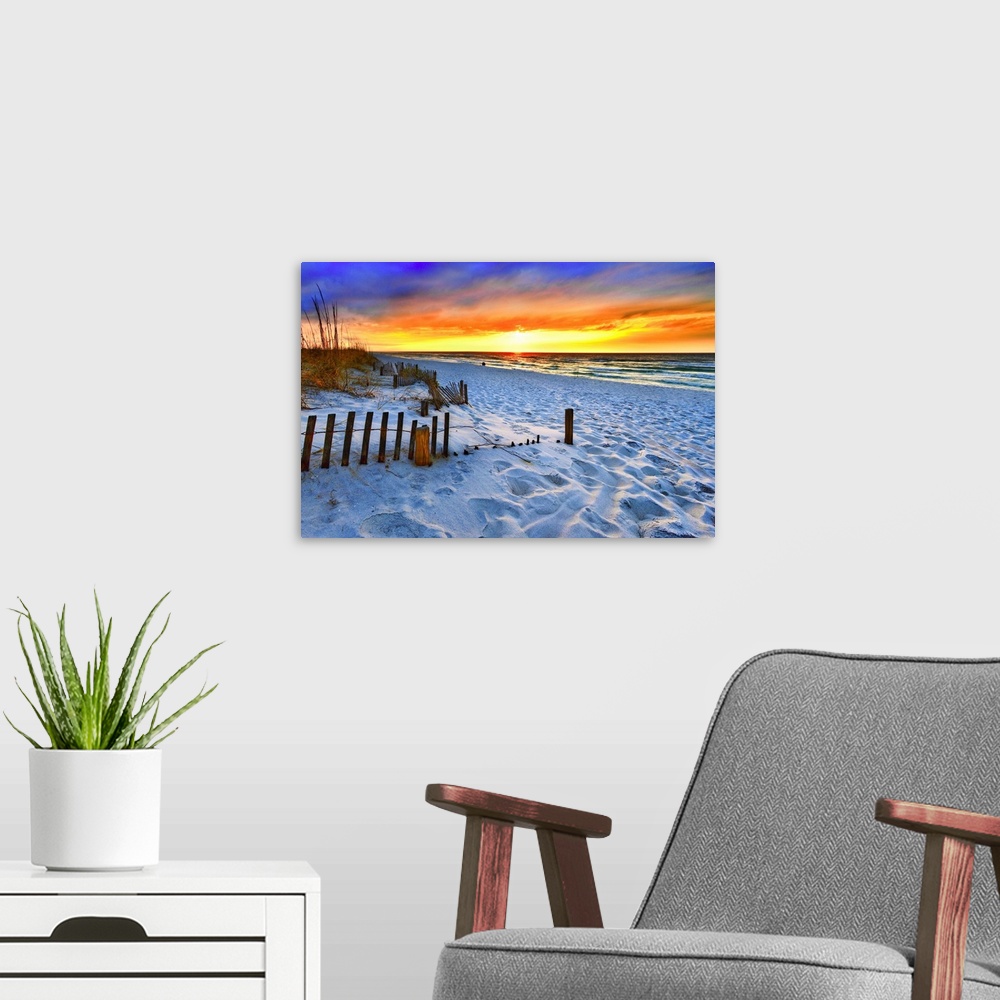 A modern room featuring A dark burning red sunset on the beach in this beautiful landscape. A burning sun sets in the dis...