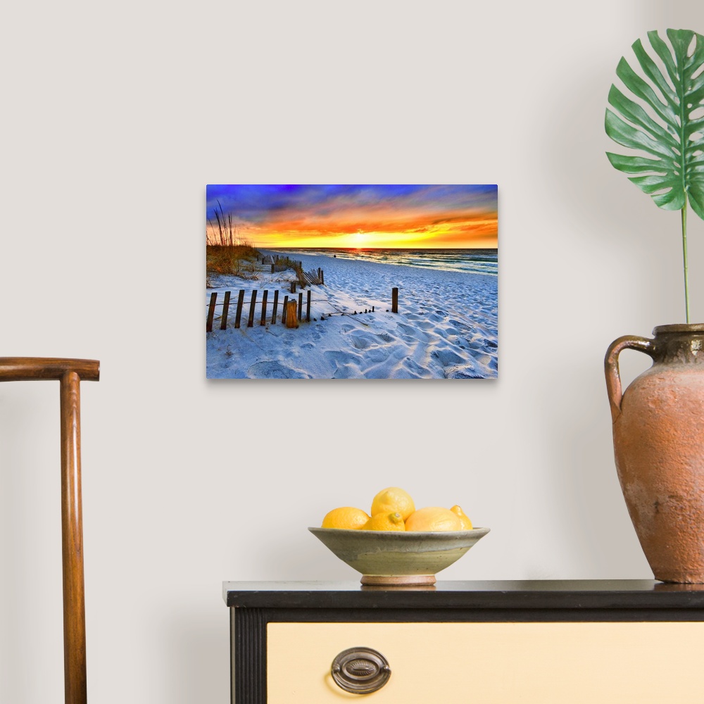 A traditional room featuring A dark burning red sunset on the beach in this beautiful landscape. A burning sun sets in the dis...