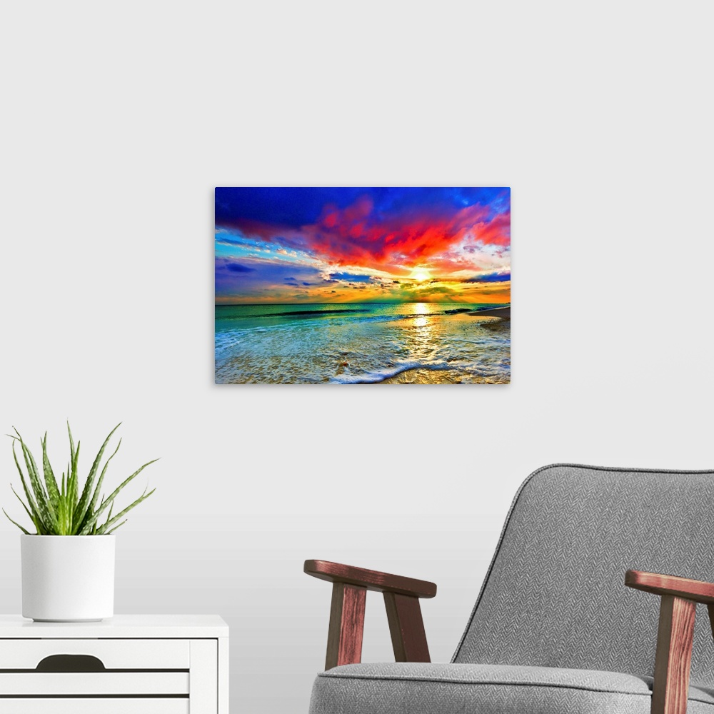 A modern room featuring A beach before a bright burning red sunset. Green waves crash onto the sandy sea shore.  Landscap...