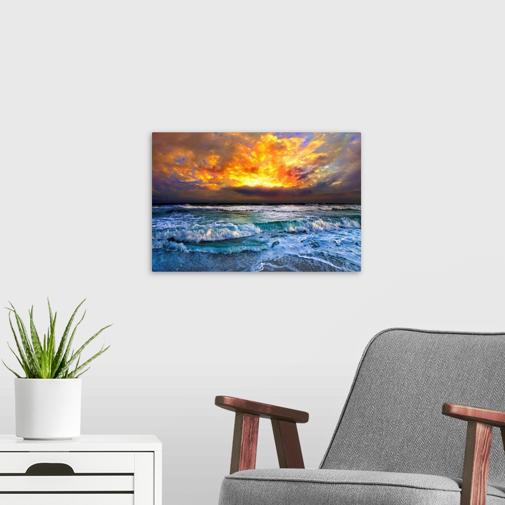 A modern room featuring A dark red and orange sunset over ocean waves. This red sunset has a beautiful ocean view with a ...
