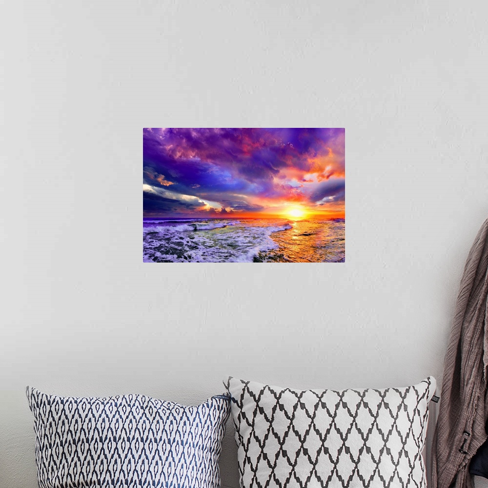 A bohemian room featuring A pink and purple abstract cloudscape and seascape at sunset.