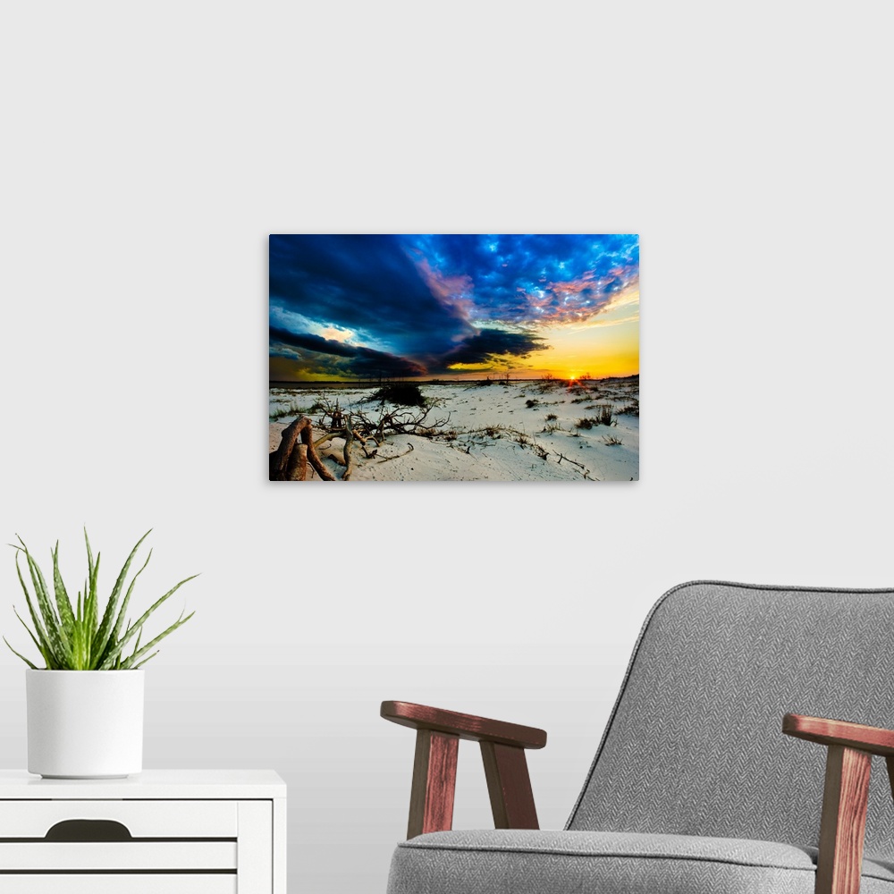 A modern room featuring Blue storm clouds encroaching on a sunset.