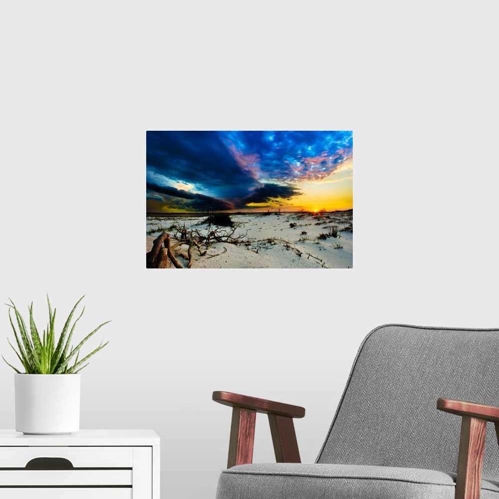 A modern room featuring Blue storm clouds encroaching on a sunset.