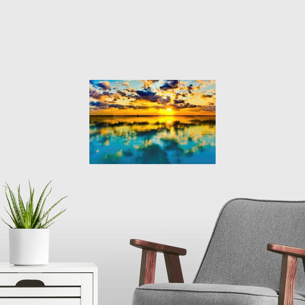 A modern room featuring A blue and yellow sunset lake reflection of a skyscape.