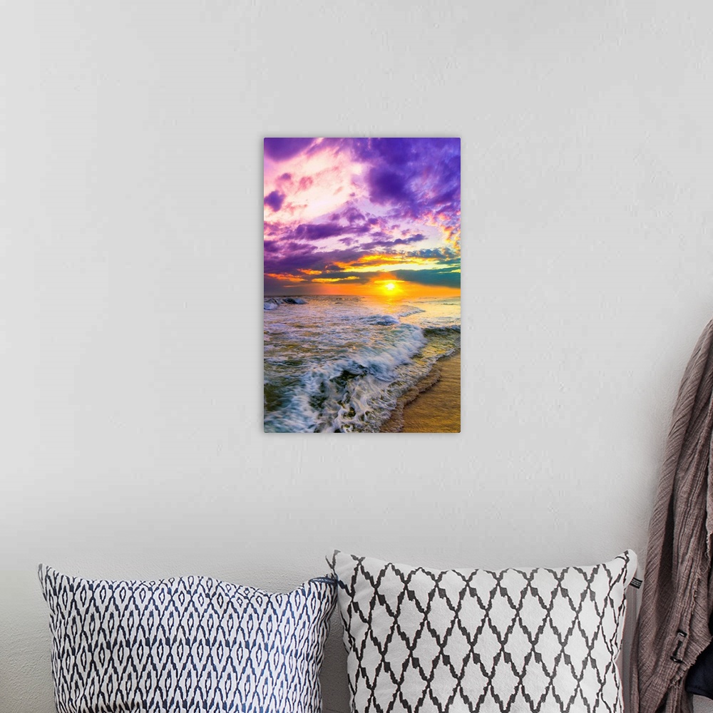 A bohemian room featuring A pink and purple beach sunset over the ocean. The expansive vertical sky is excellent for a vert...