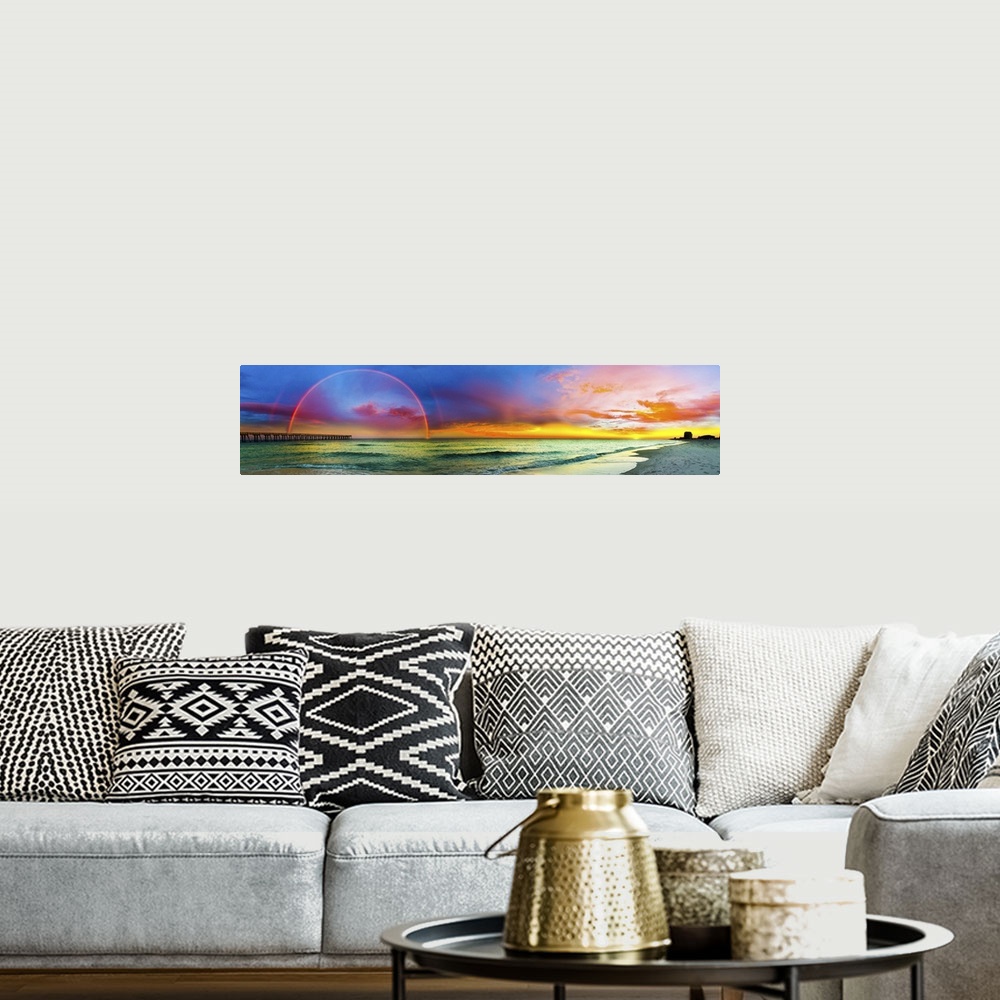 A bohemian room featuring A wide panorama of a double rainbow over the beach in Florida.
