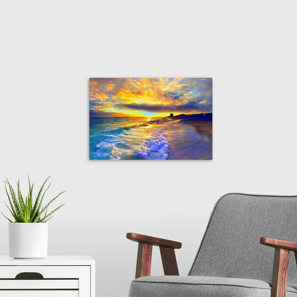 A modern room featuring A beautiful yellow sunrise with foaming ocean waves striking the beach. Yellow clouds burst into ...