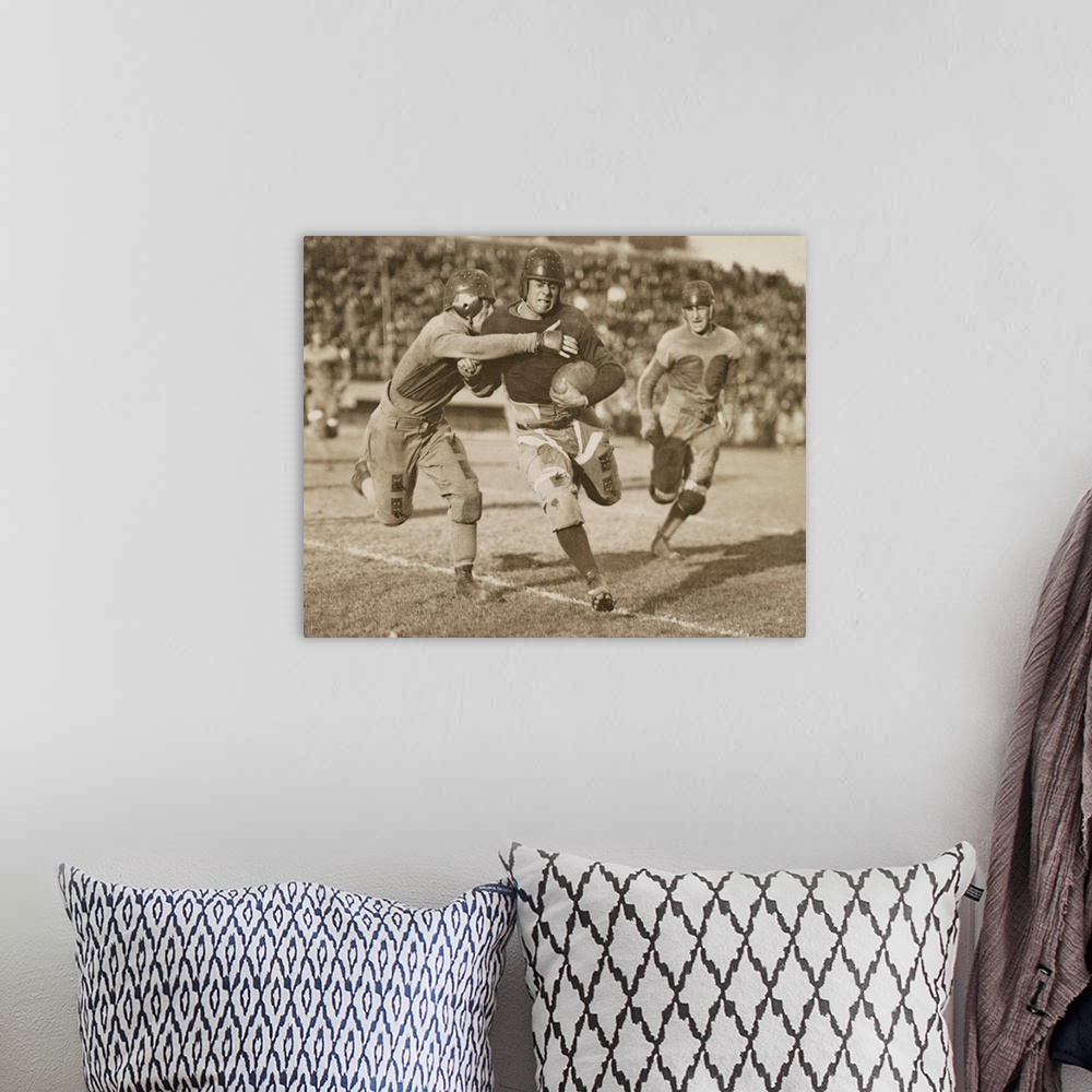 A bohemian room featuring 1920s football action. Hundreds of spectators watch from stadium seats.