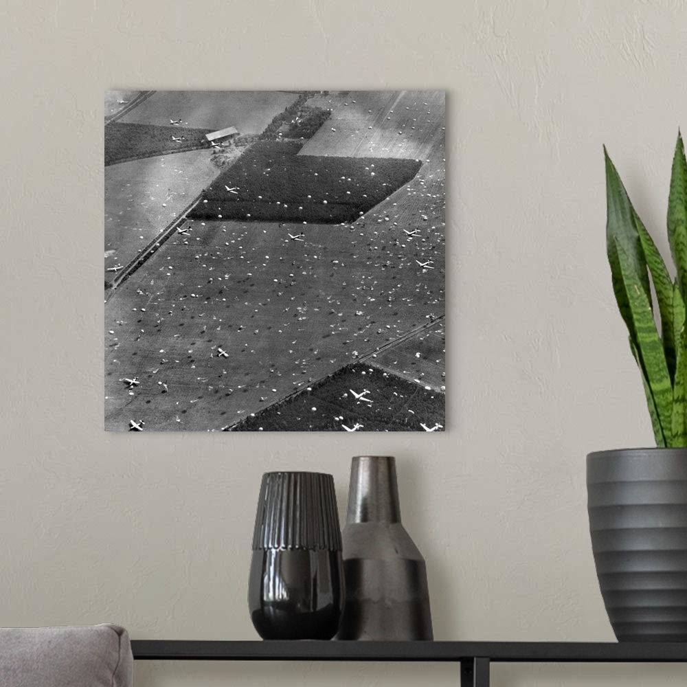 A modern room featuring Allied planes drop paratroopers onto Holland's fields already dotted with gliders and airborne tr...