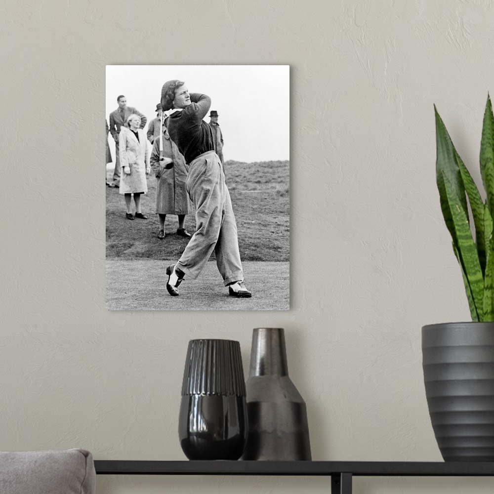 A modern room featuring Babe Didrikson, watching golf ball as she completes her swing. The multisport athlete was playing...