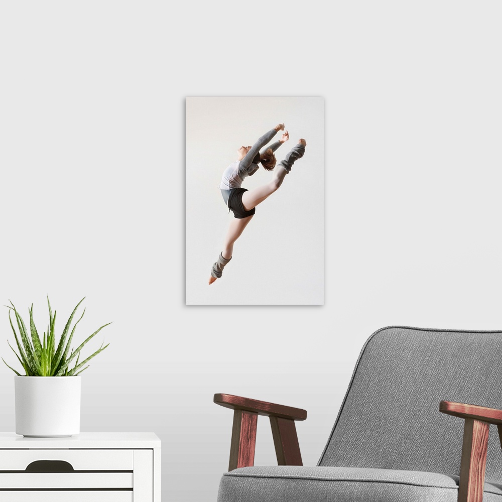A modern room featuring Ballerina Leaping In Mid-Air