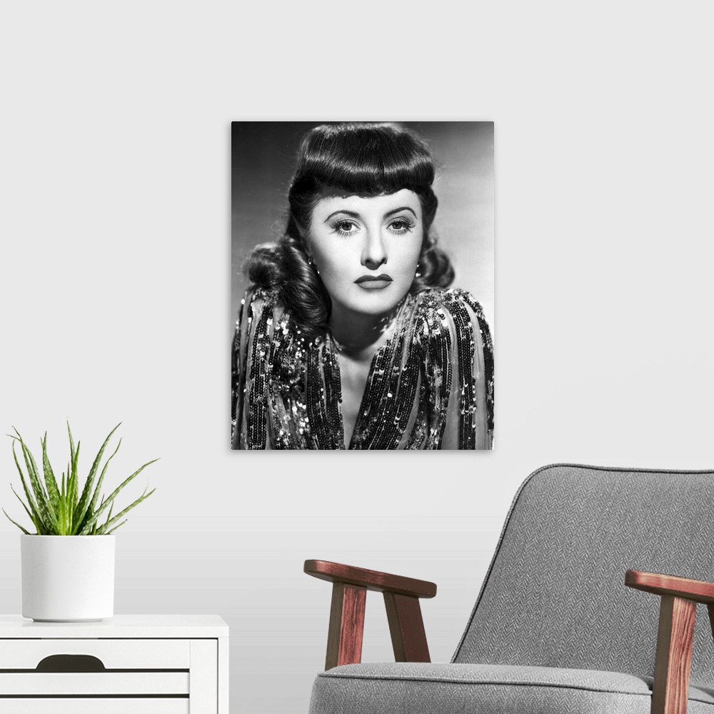 A modern room featuring Barbara Stanwyck in Ball Of Fire - Vintage Publicity Photo