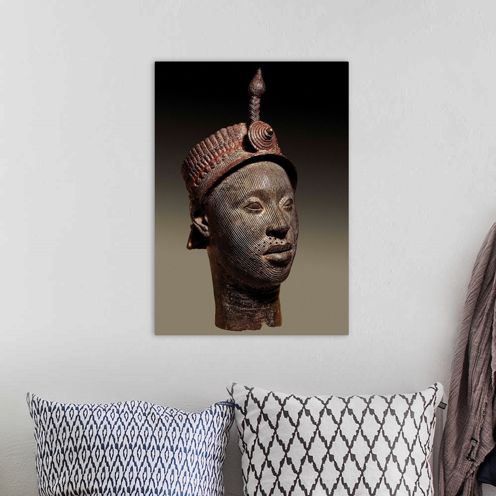 A bohemian room featuring Bronze head with beaded crown and plume, Yoruba art