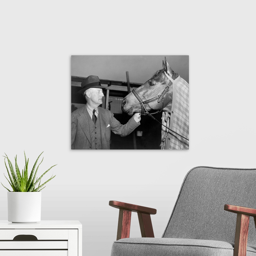 A modern room featuring Charles Howard admiring his horse Seabiscuit, March 5, 1940. Seabiscuit had just won the Santa An...