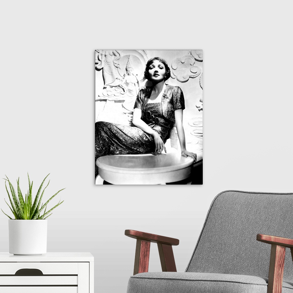 A modern room featuring Claudette Colbert - Vintage Publicity Photo