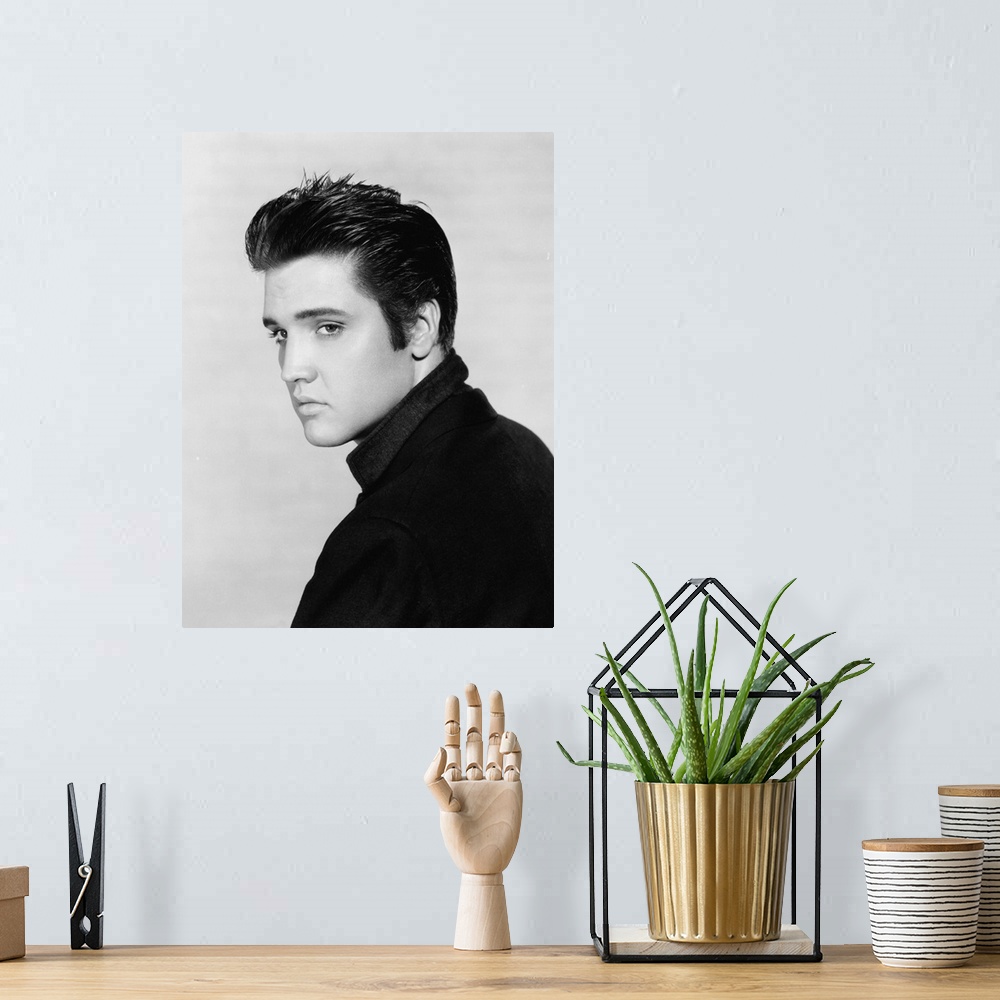 A bohemian room featuring Black and white photograph of Elvis Presley.