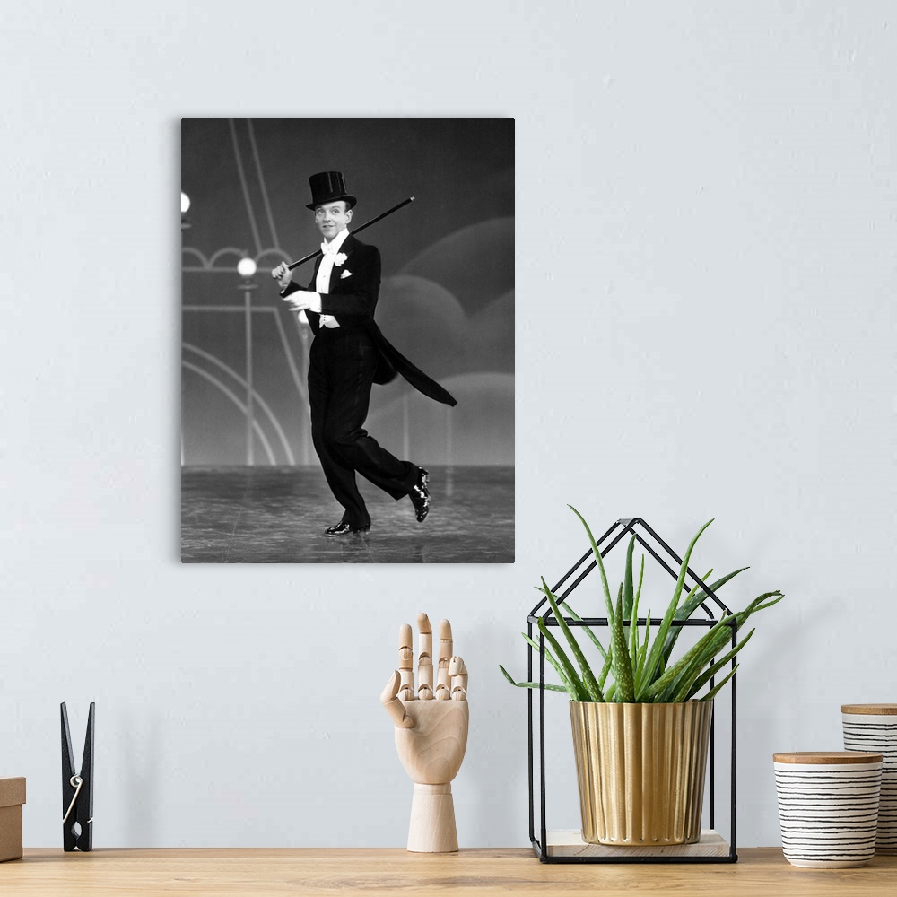 A bohemian room featuring Fred Astaire in Top Hat - Vintage Publicity Photo