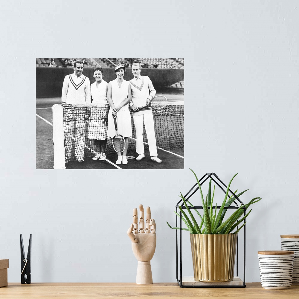 A bohemian room featuring Fred Perry and Betty Nuthall (left) of Britain won the French Mixed Doubles Championship. June 7,...