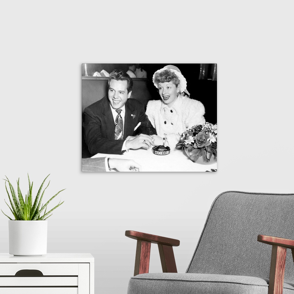 A modern room featuring Black and white photograph of Desi Arnaz and Lucille Ball.