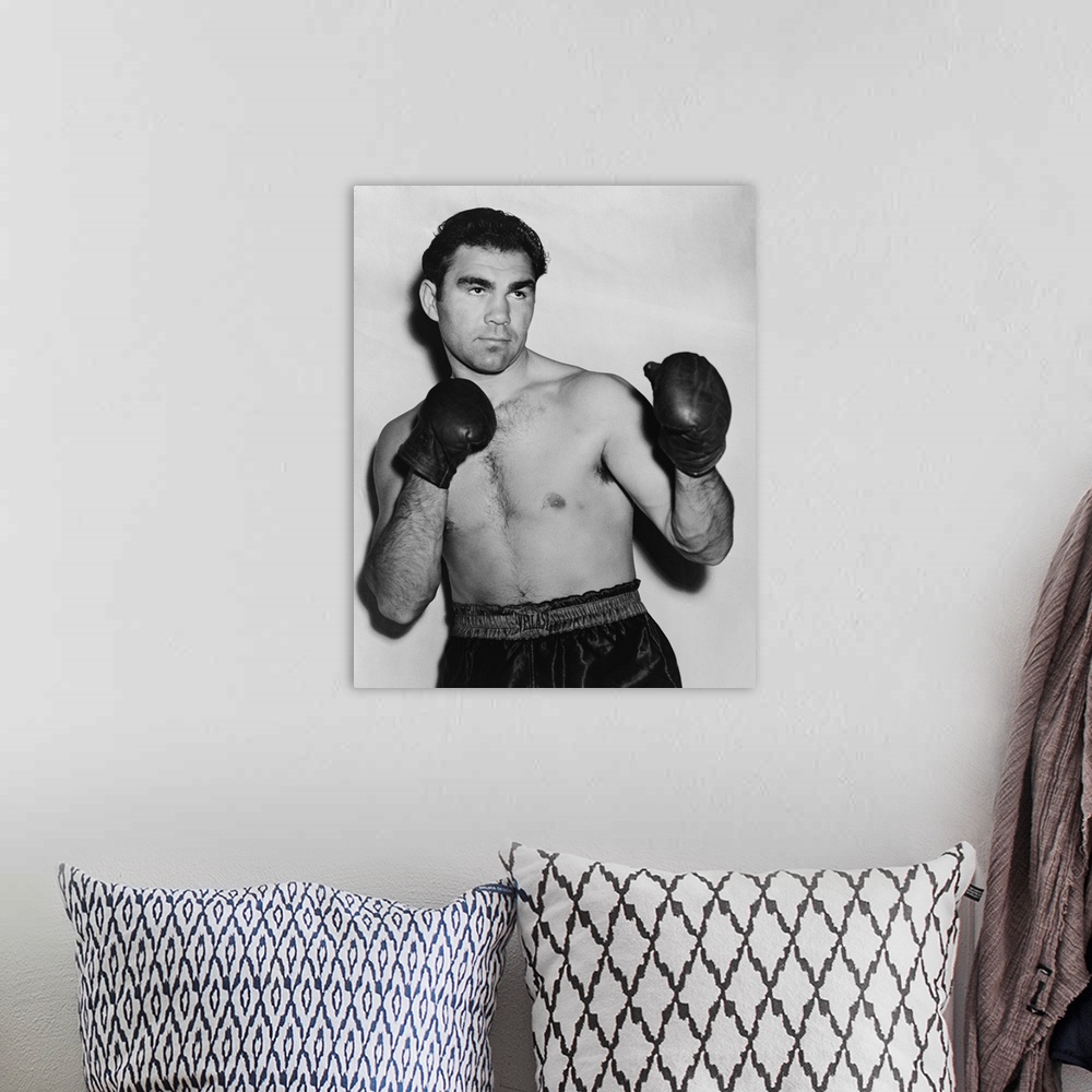 A bohemian room featuring German boxer Max Schmeling in a boxing pose in 1938. On June 22, 1938 he lost in a rematch with A...