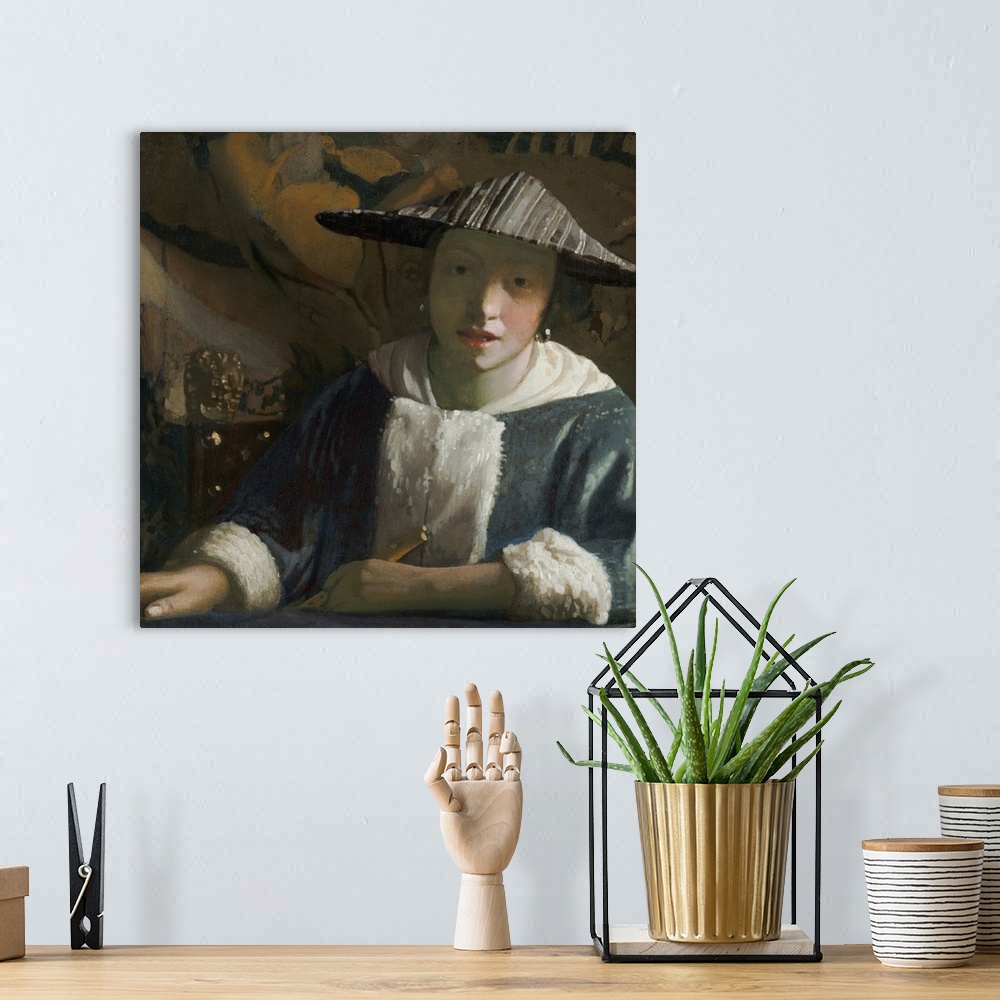 A bohemian room featuring Girl with a Flute, by Johannes Vermeer, c. 1665-70, Dutch painting, oil on canvas. She wears a ha...