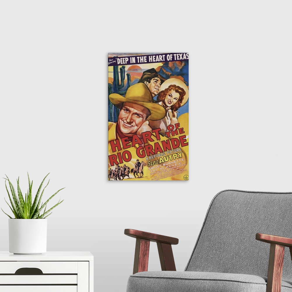 A modern room featuring HEART OF THE RIO GRANDE, US poster art, from left: Gene Autry, Smiley Burnette, Fay McKenzie, 1942