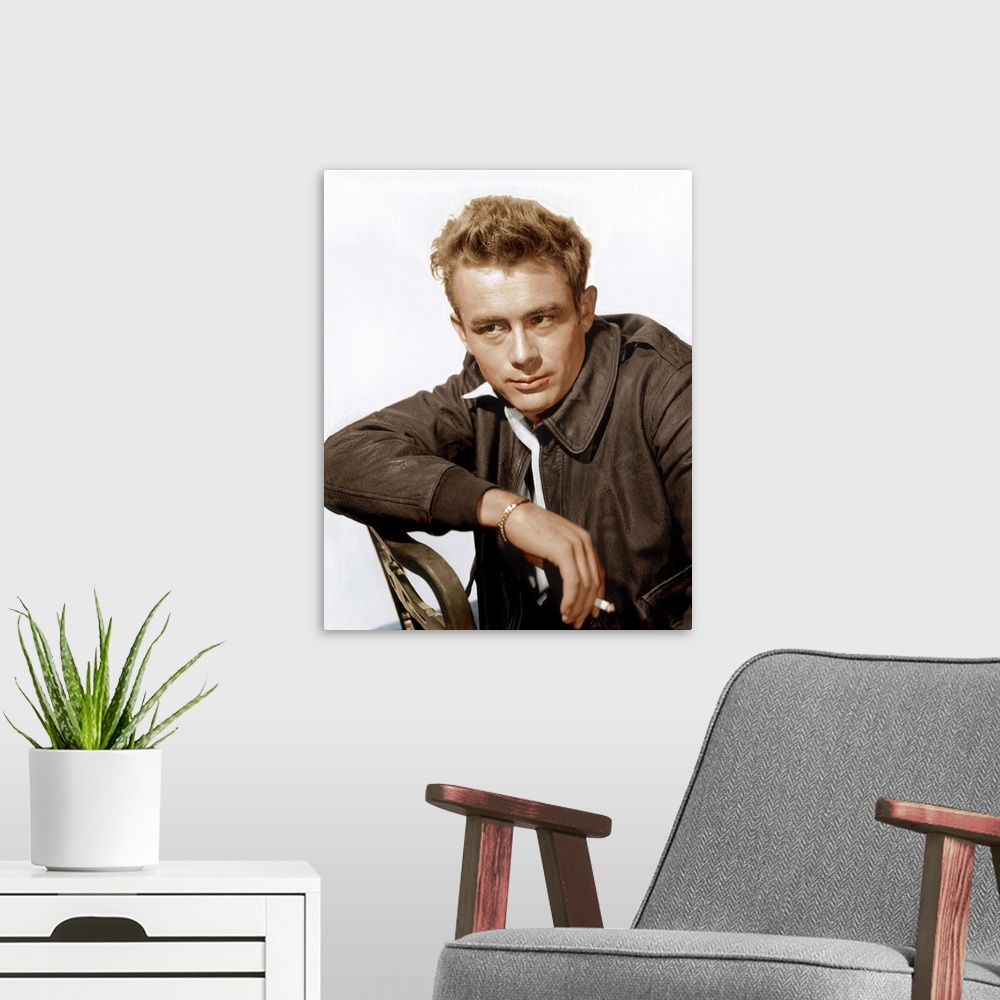 A modern room featuring A vintage photograph of the actor James Dean leaning against a chair, to promote his film "Rebel ...