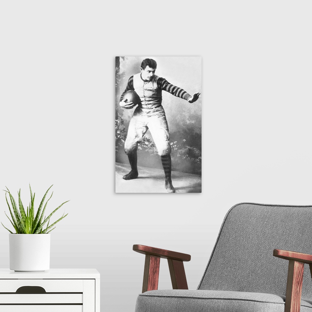 A modern room featuring John Heisman in his University of Pennsylvania football uniform, c. 1891. He played football at B...