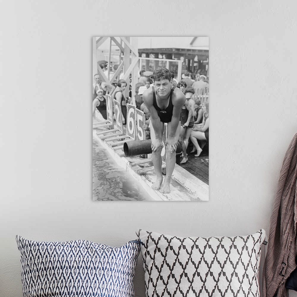 A bohemian room featuring Johnny Weissmuller at competitive swimming event in the 1920s. After winning five Olympic gold me...