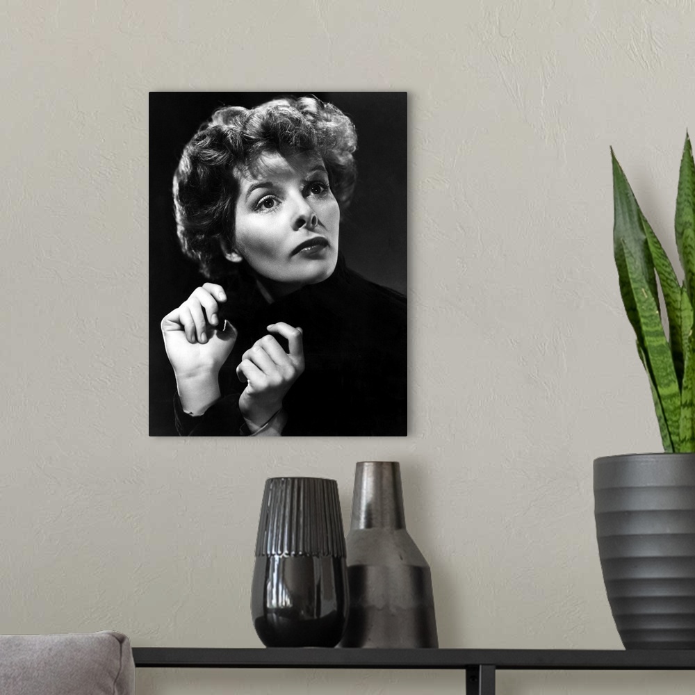 A modern room featuring Katharine Hepburn in Break of Hearts - Vintage Publicity Photo