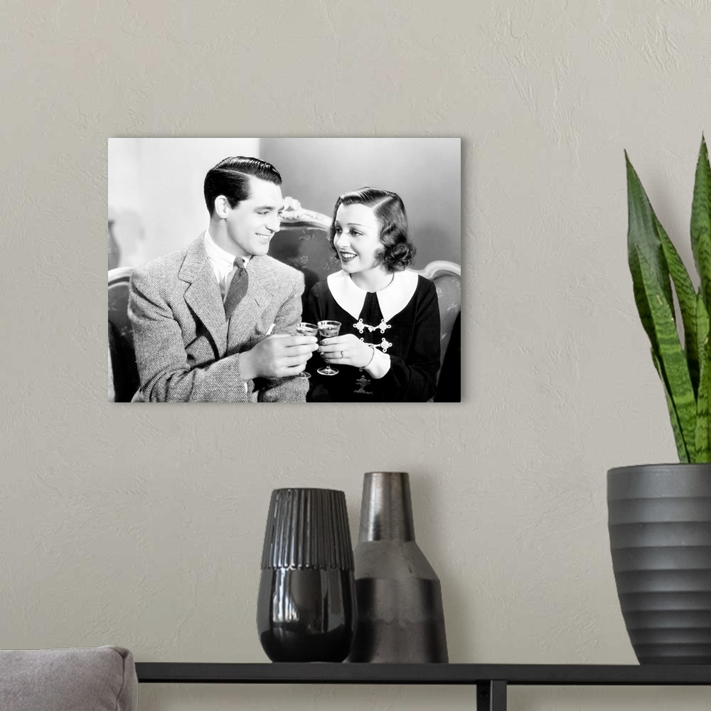 A modern room featuring Ladies Should Listen, From Left: Cary Grant, Frances Drake, 1934.