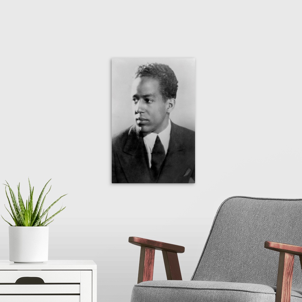 A modern room featuring Langston Hughes, African American poet, novelist, playwright, and journalist, ca. 1930.