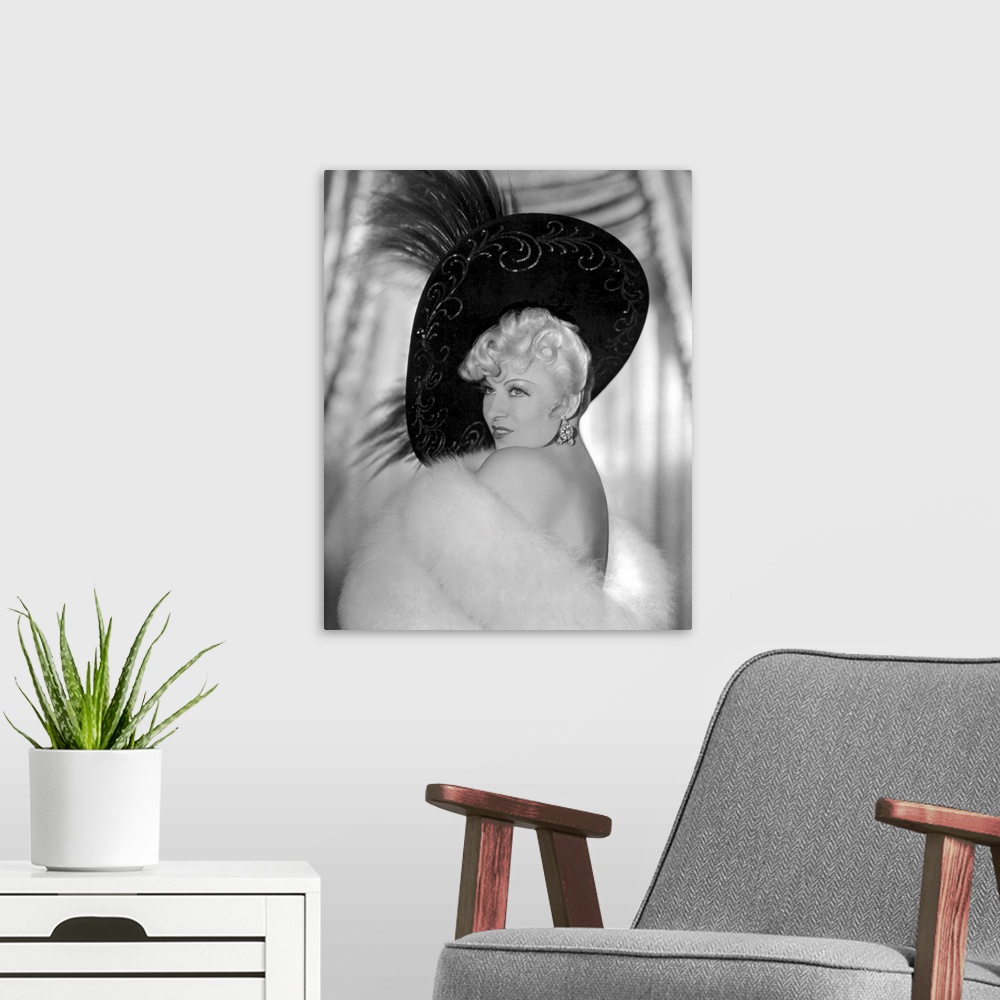 A modern room featuring Mae West in Every Day's A Holiday - Vintage Publicity Photo