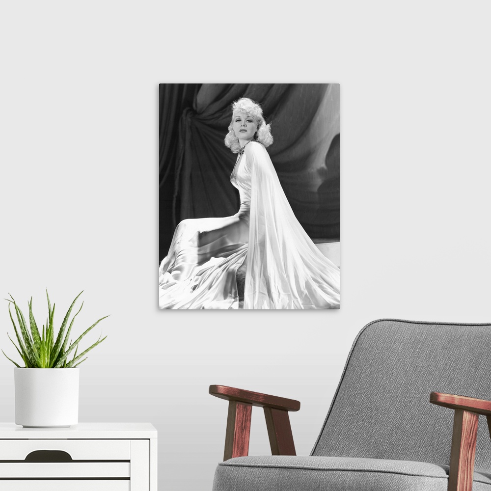A modern room featuring Black and white photograph of Marion Martin.