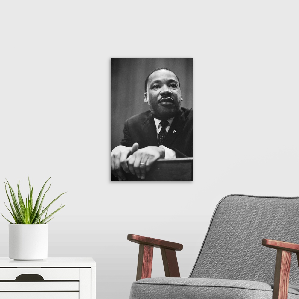 A modern room featuring Martin Luther King at a press conference in Washington, D.C. on March 26, 1964.