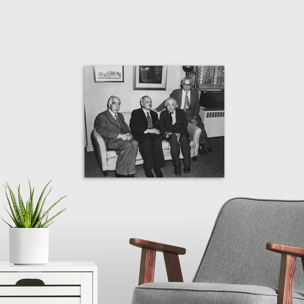 A modern room featuring Portrait of four famous nuclear physicists. L-R: Niels Bohr; James Franck; Albert Einstein; and I...