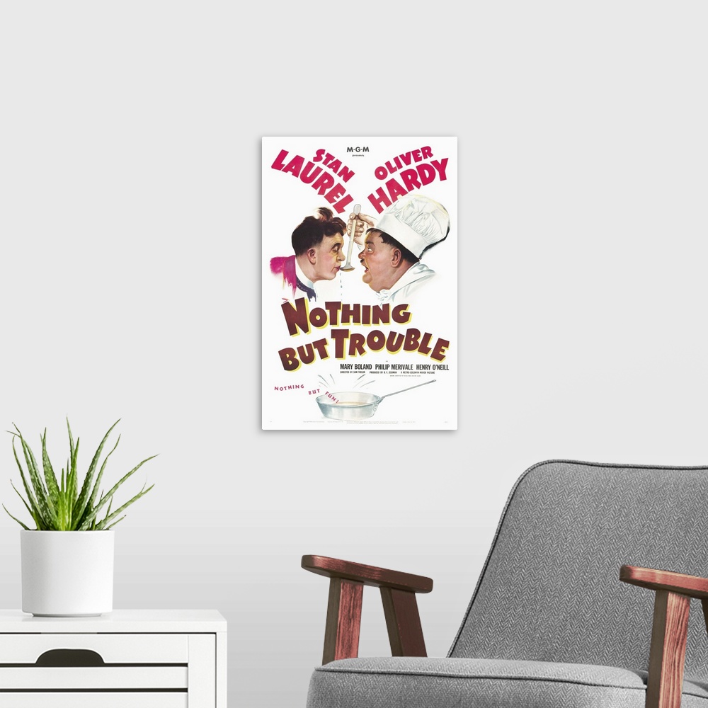 A modern room featuring Nothing but Trouble - Vintage Movie Poster