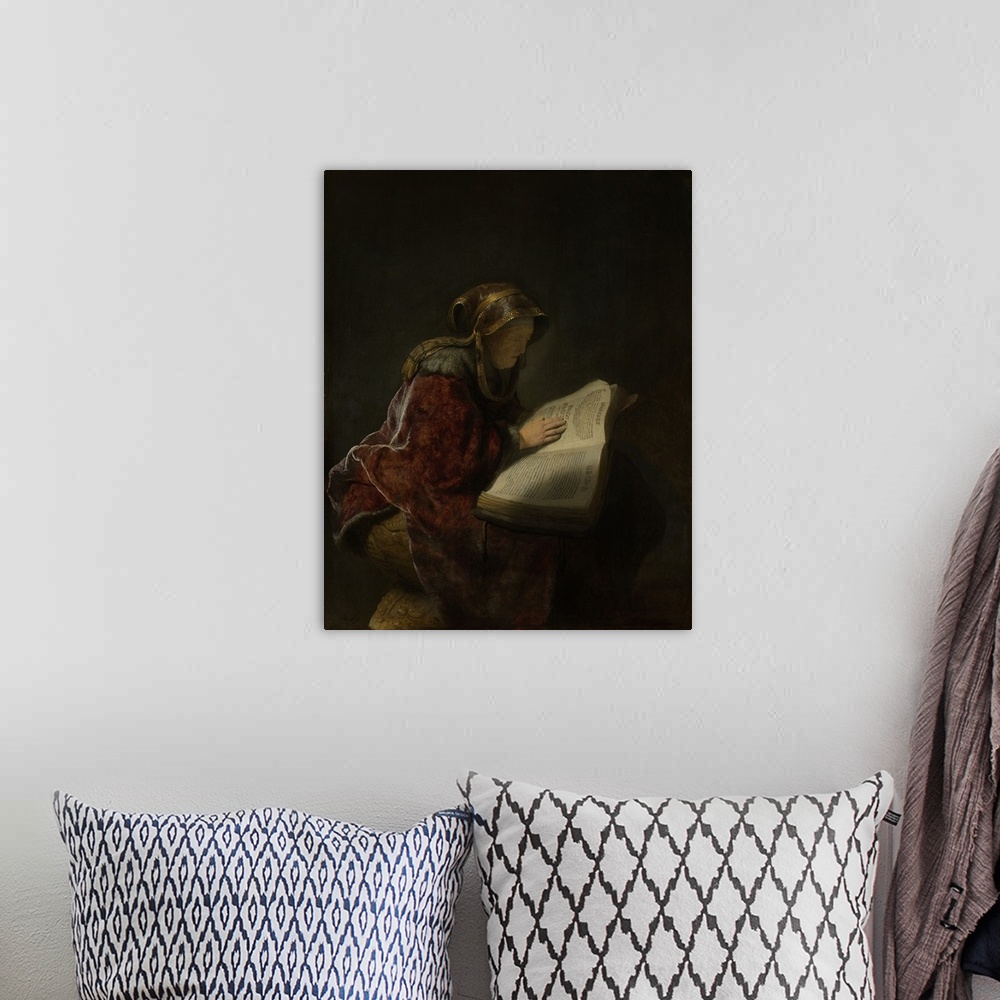 A bohemian room featuring Old Woman Reading, Probably the Prophetess Hannah, by Rembrandt, 1631, Dutch painting, oil on pan...
