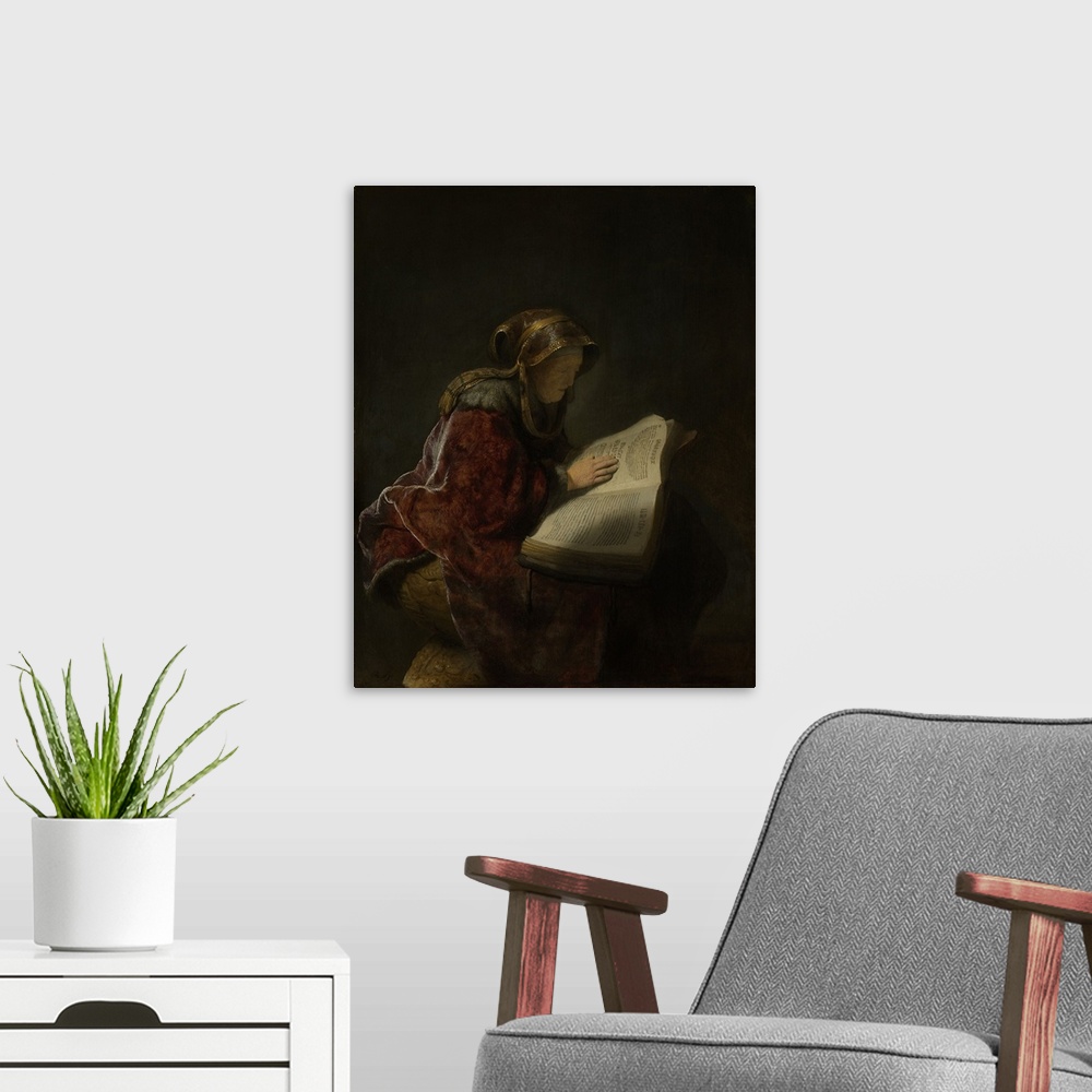 A modern room featuring Old Woman Reading, Probably the Prophetess Hannah, by Rembrandt, 1631, Dutch painting, oil on pan...