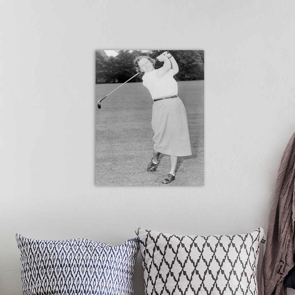 A bohemian room featuring Patty Berg playing golf in 1951. She was a founding member and player on the LPGA Tour. She won 1...