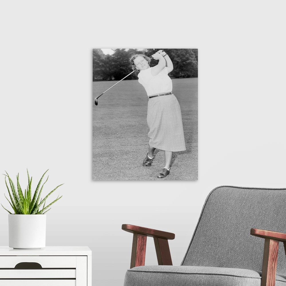 A modern room featuring Patty Berg playing golf in 1951. She was a founding member and player on the LPGA Tour. She won 1...